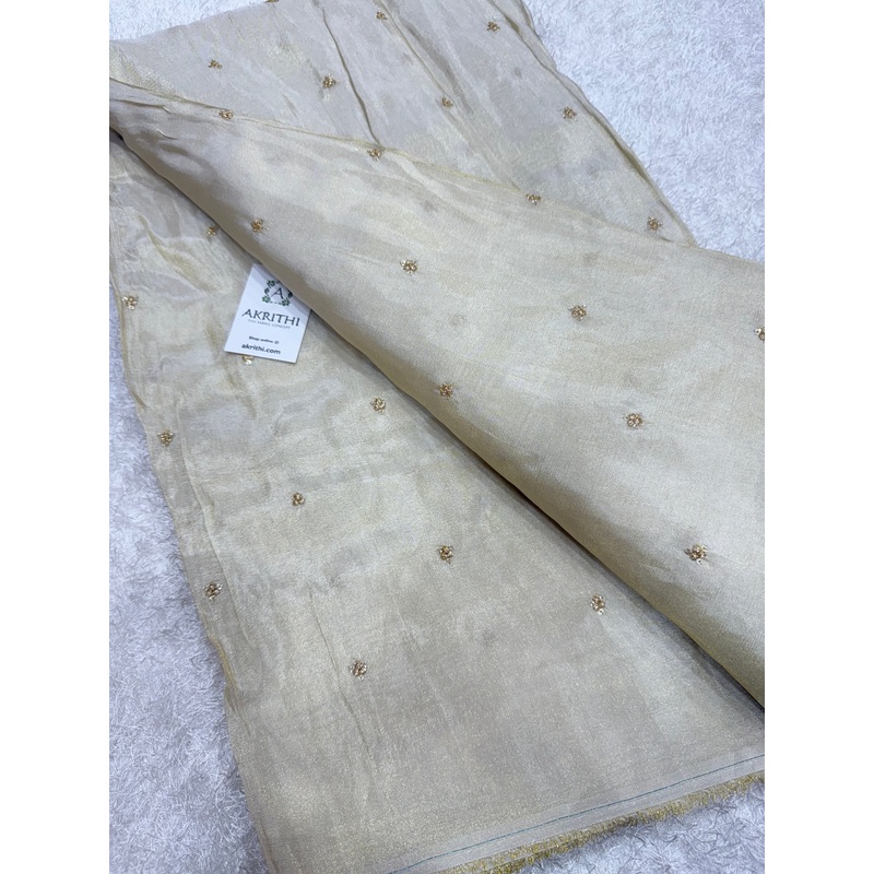 Sequins on dyeable tissue fabric